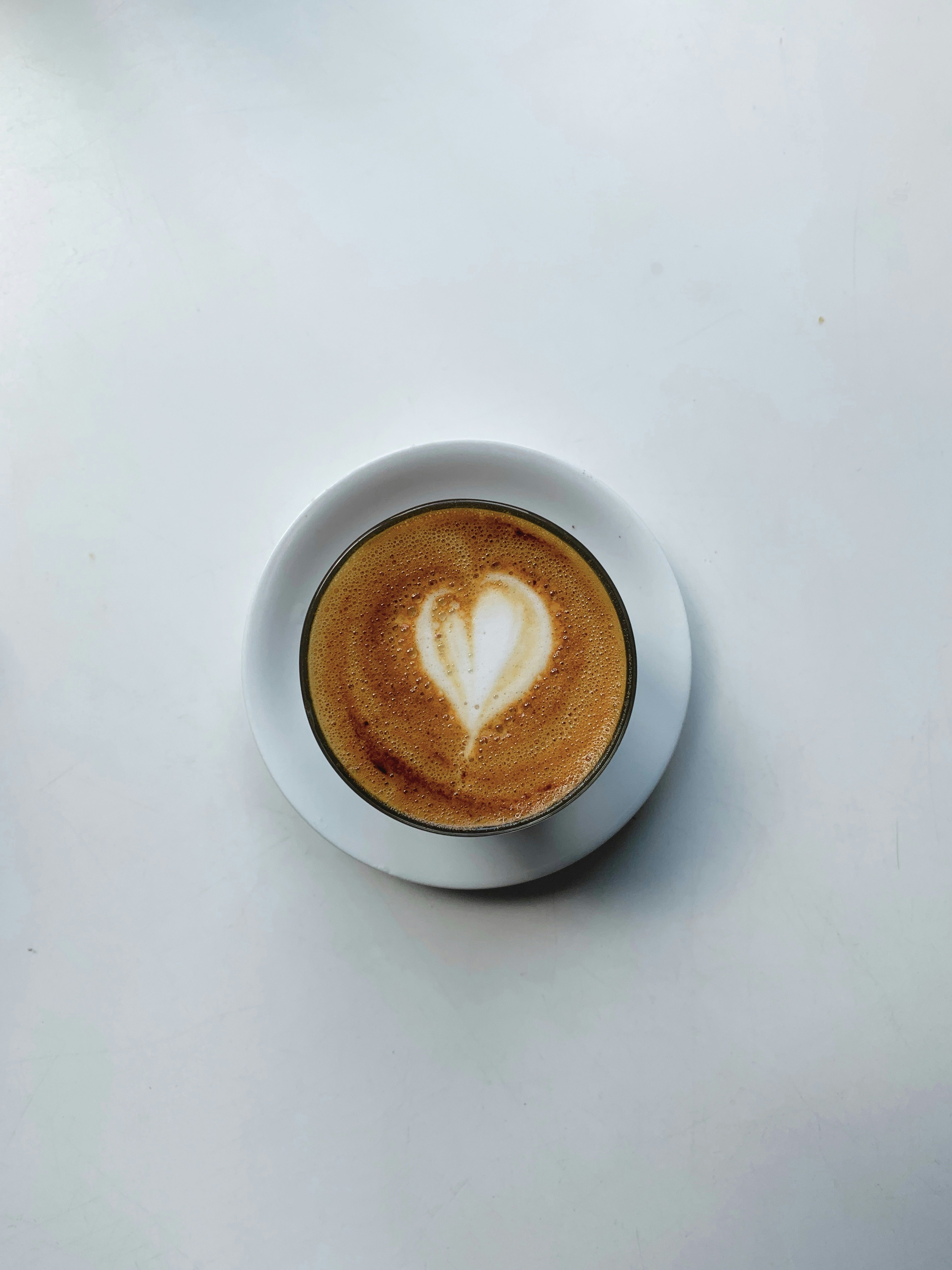 white ceramic cup filled with coffee